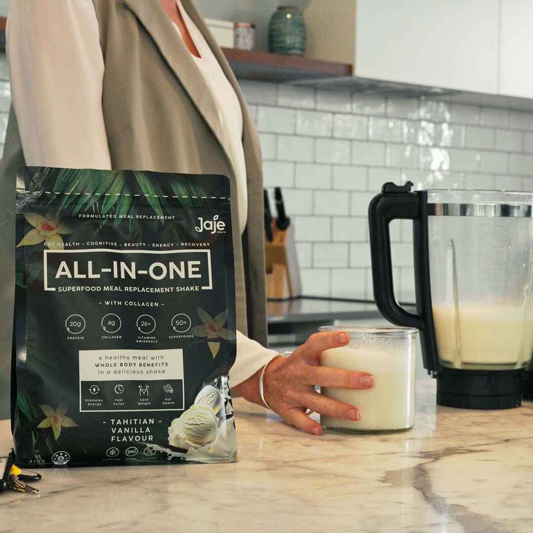 Jaje Tahitian Vanilla All-In-One meal replacement shake being mixed in a blender
